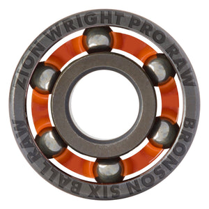 A close-up studio shot of a Zion Wright Pro Raw Bronson Six Ball Raw bearing, showing the inner ring, orange cage, steel balls, and outer ring with engraved text on a white background.