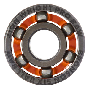A close-up studio shot of a Zion Wright Pro Raw Bronson Six Ball Raw bearing, showing the inner ring, orange cage, steel balls, and outer ring with engraved text on a white background.