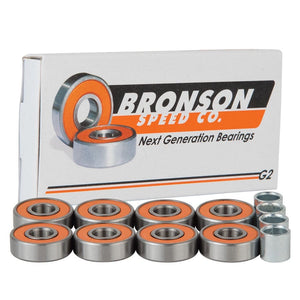 8 orange shield Bronson g2 bearings next to packaging and spacers