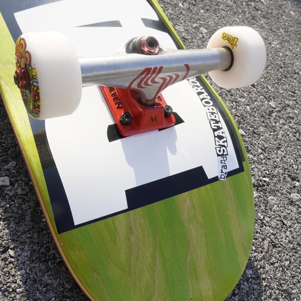 close uo images of skateboard trucks and wheels