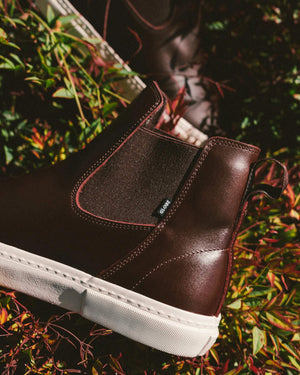 brown boot model globe Dover II in oxblood in forrest background