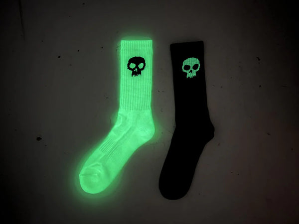 Zero skateboards, glow-in-the-dark socks, black, and white image