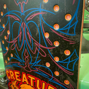Drilled cnc holes on pinstripe finished on creature skateboard deck