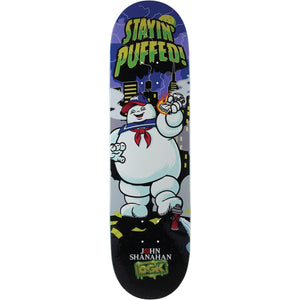 A skateboard deck featuring a Ghostbusters graphic with the Stayin' Puffed ghost character, a purple night sky, and 'JOHN SHANAHAN ROCK' printed at the bottom.