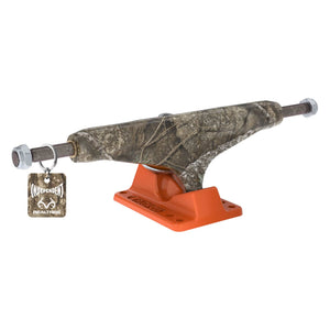 A single independent stage 11 skateboard truck with a Realtree Apx camouflage patterned with bright orange base plate 