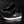 Black DC js2 Shanahan  sneakers with white soles on a dark surface
