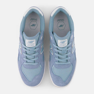 Pair of light blue New Balance numeric Knox 600  sneakers with New Balance logo on a white background