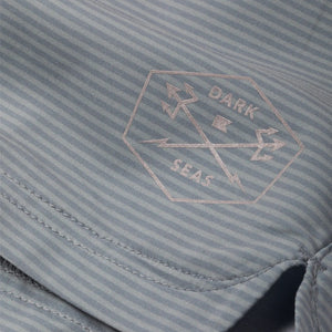 Close-up of any sweat storm  blue striped fabric with 'Dark Seas' logo.