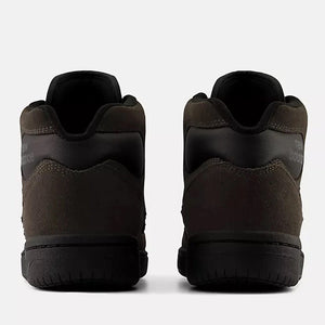 A pair of dark brown new balance 480 high-top shown from the back, featuring a textured suede-like upper and thick black soles, set against a light gray background.