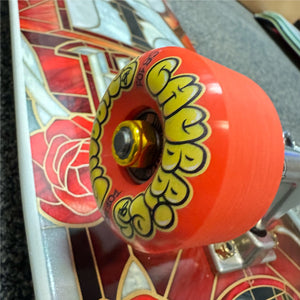 close up on oj chubbies orange skateboard wheels on real complete skateboard 