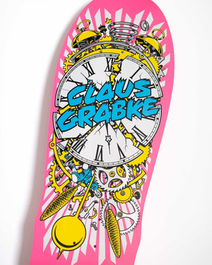Close-up of Jim Phillips Exploding Clock artwork on the neon pink Santa Cruz Grabke reissue deck