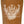 Top view of the Santa Cruz Rankine Monster Reissue 10.39-inch skateboard deck with brown stain and laser-engraved artwork