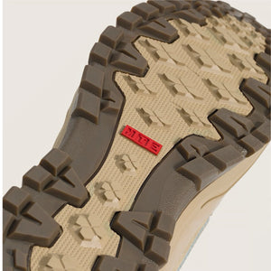 Close-up of Vans sk8-Hi MTE  sole with tread pattern and MTE logo on a beige background