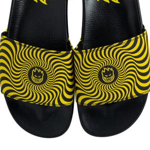 Top view of SPITFIRE Bighead Swirl Slides in black and yellow with swirl graphic close up view