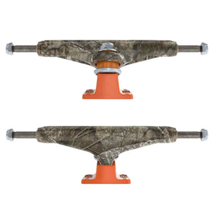 a set of independent skateboard trucks with real tree camouflage-patterned  and bright orange polyurethane bushings, 