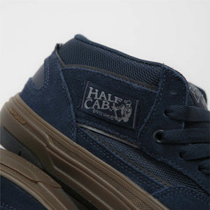 Navy blue waffle cup  'Half Cab' logo close up on a light gray background