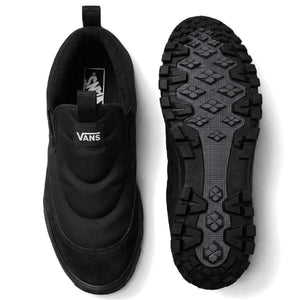 Vans Mid-Slip Puff Black/Black shown from above beside the lugged outsole, with quilted upper and Vans tongue logo