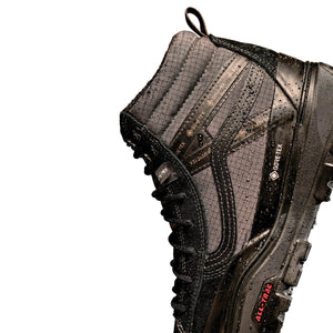 Side close-up of Vans Sk8-Hi GORE-TEX Insulated MTE Black/Black showing water droplets, the padded collar and rubber sidewall