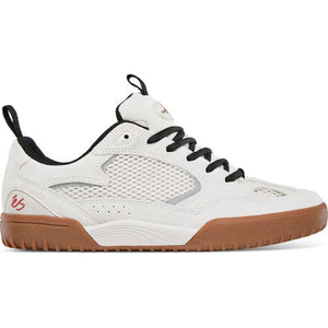 White sneaker with black accents and brown sole on a white background