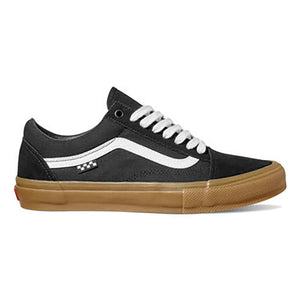 Black sneaker with white laces and brown sole on a white background
